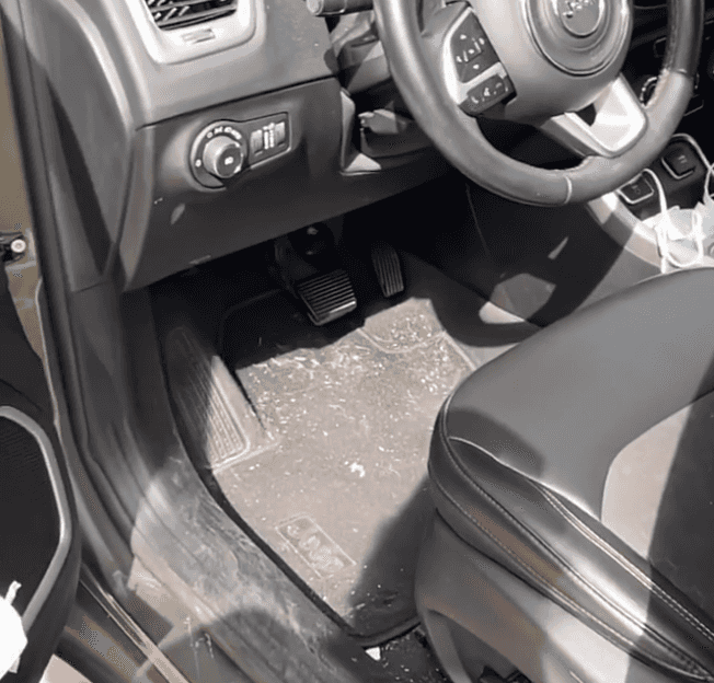 Jeep driver footwell and floor mat before interior detailing